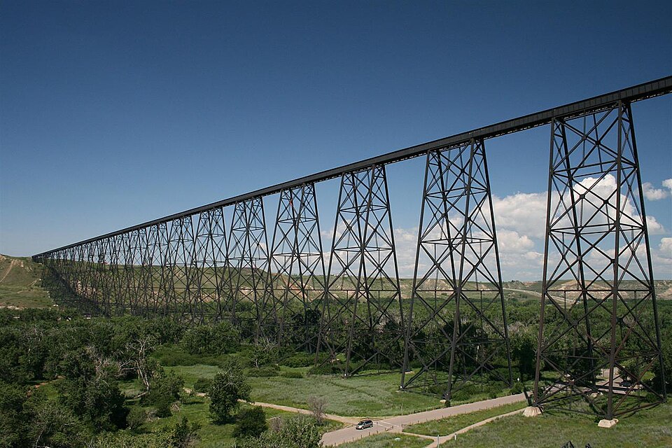 High Level Bridge spanning a green valley under blue sky in Lethbridge.