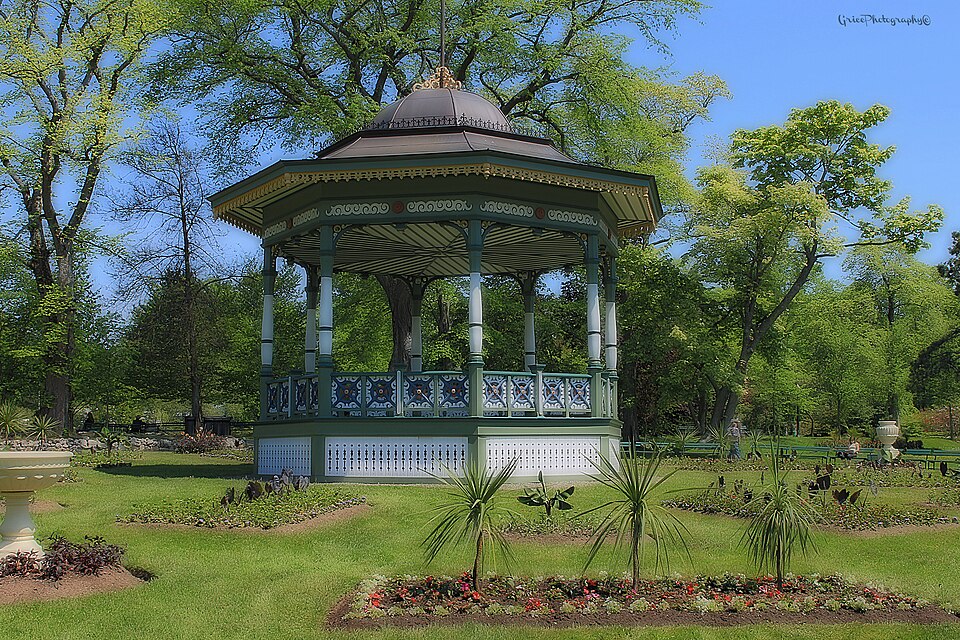 Bandstand, trees and blue sky in Halifax Public Gardens.