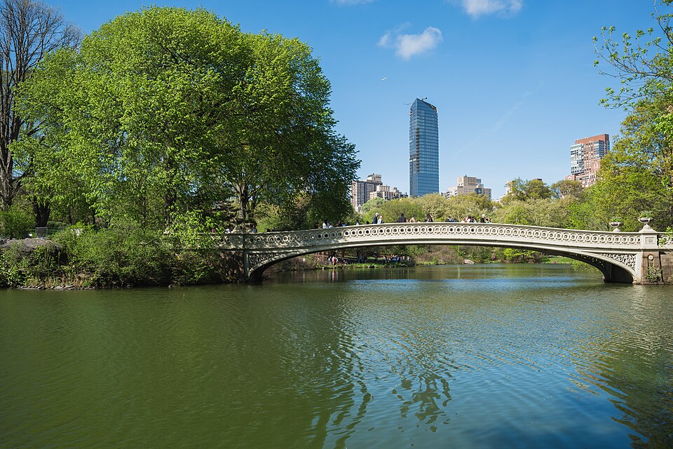 Bow Bridge and Manhattan skyline from Central Park in New York City.